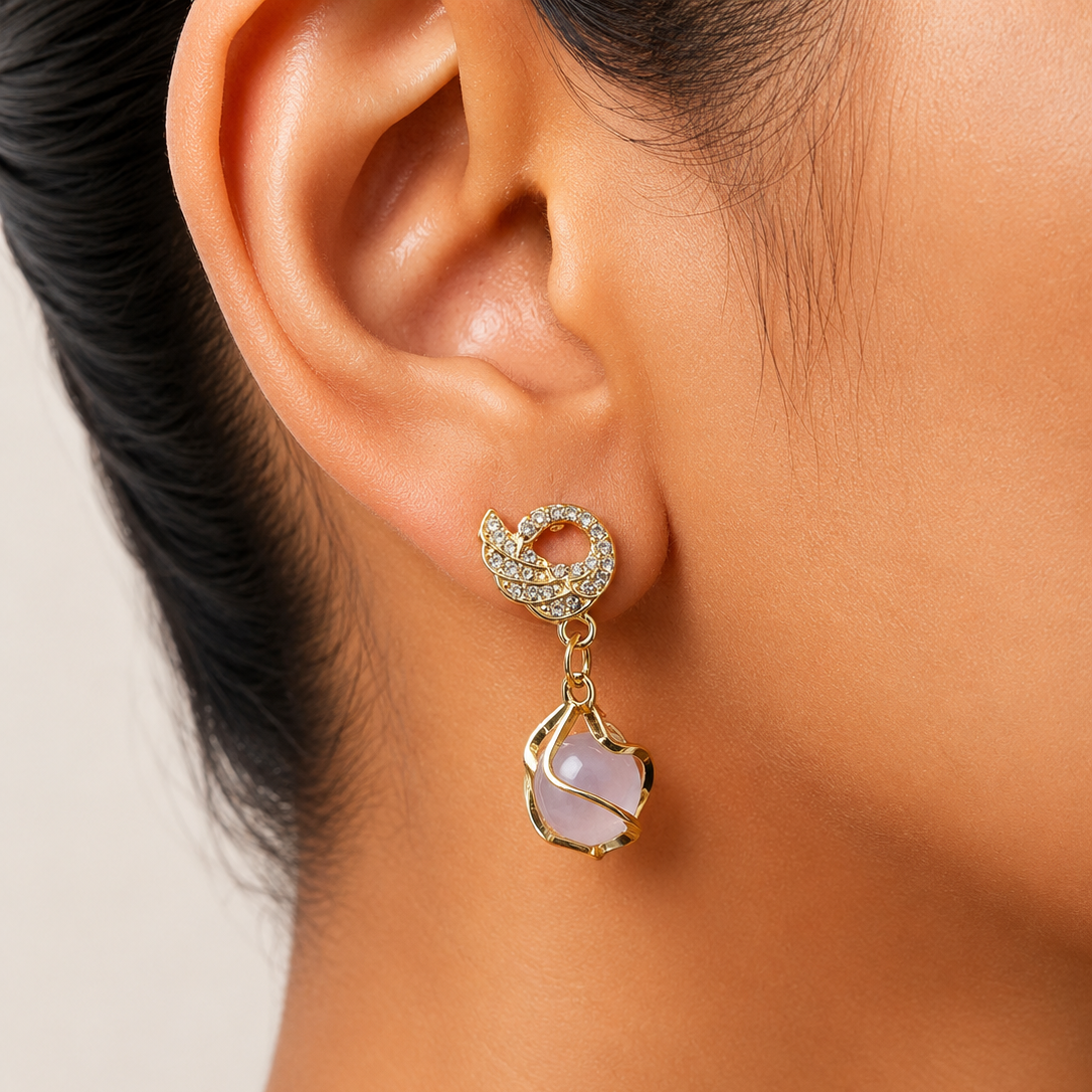 Close-up of an earring worn on a person's ear with a neutral background