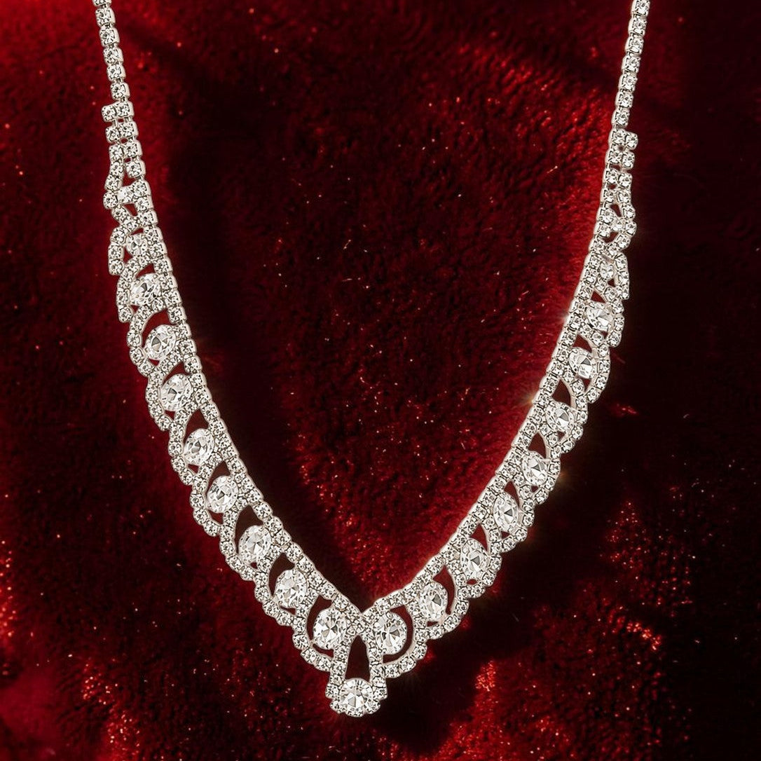 Silver necklace with american diamonds on a red velvet background