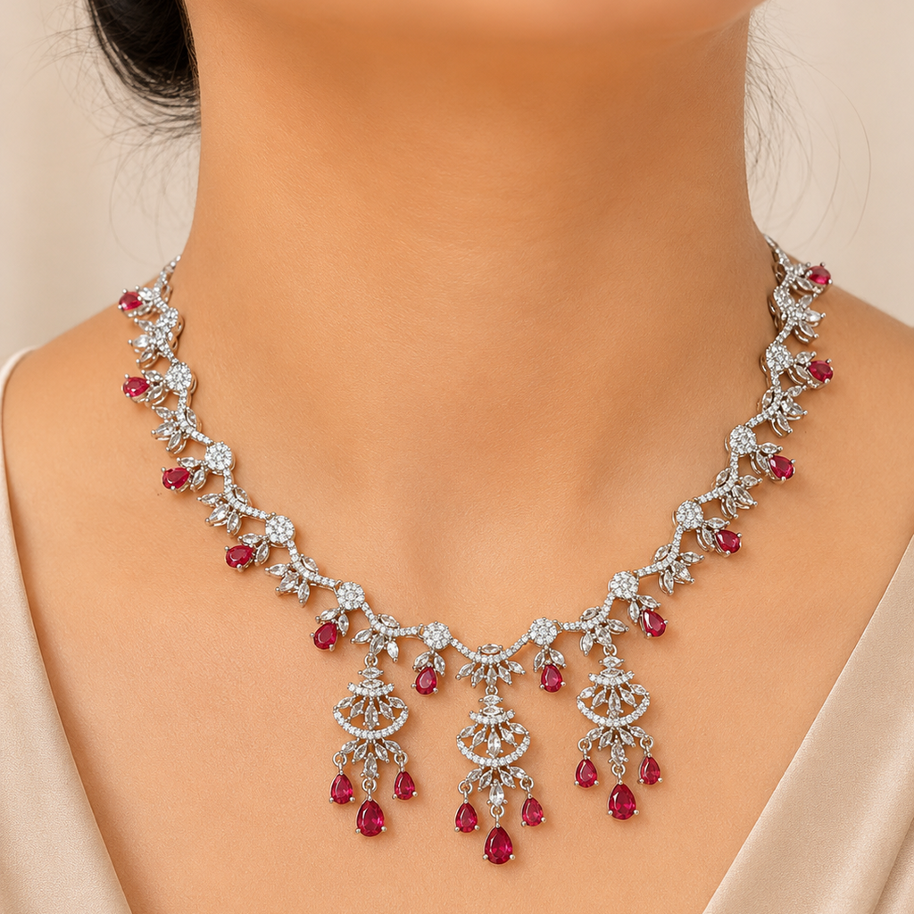 Delicate necklace with red gemstones on a mannequin