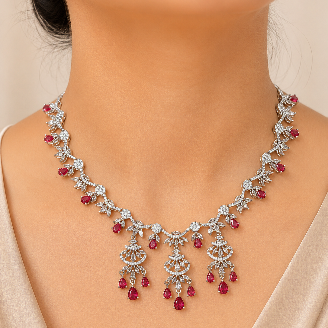 Delicate necklace with red gemstones on a mannequin