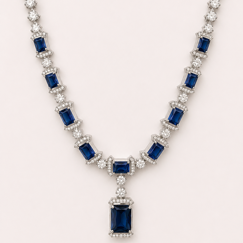 Elegant necklace with blue gemstones and diamonds on a white background